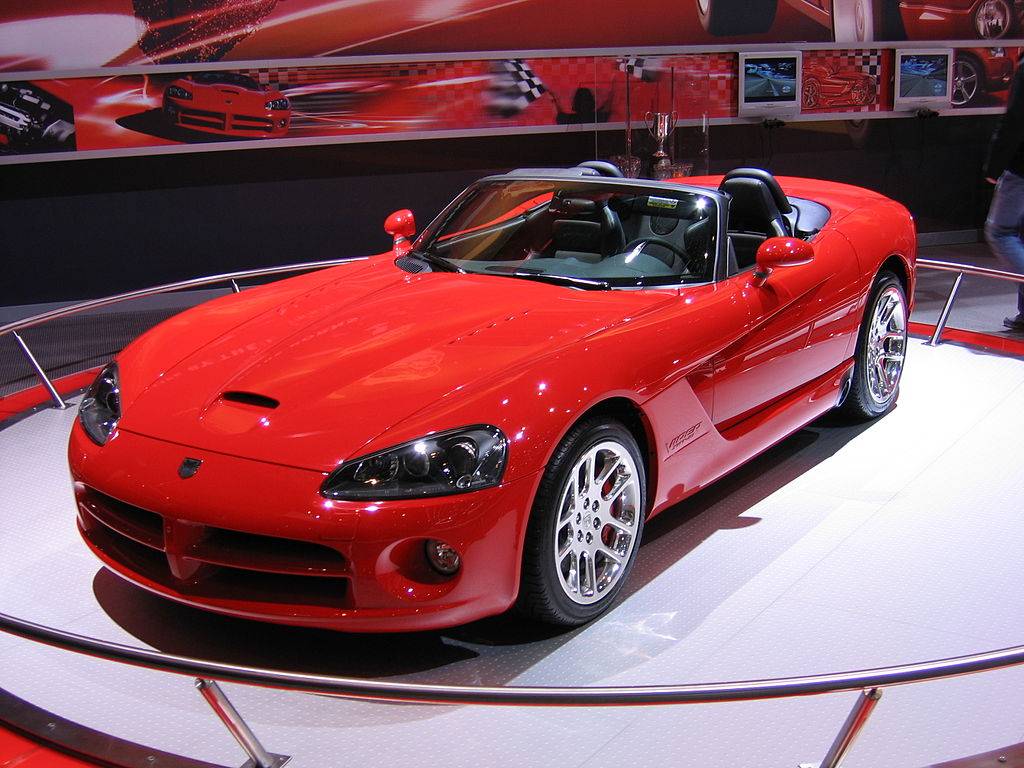 Close Up Photo of Red 2002 Dodge Viper GTS displayed at exhibition.
