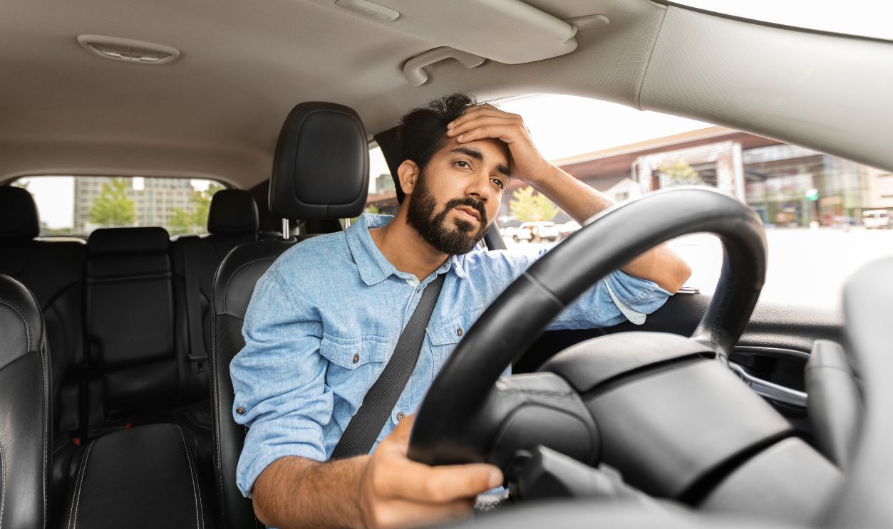 Stressed man in car