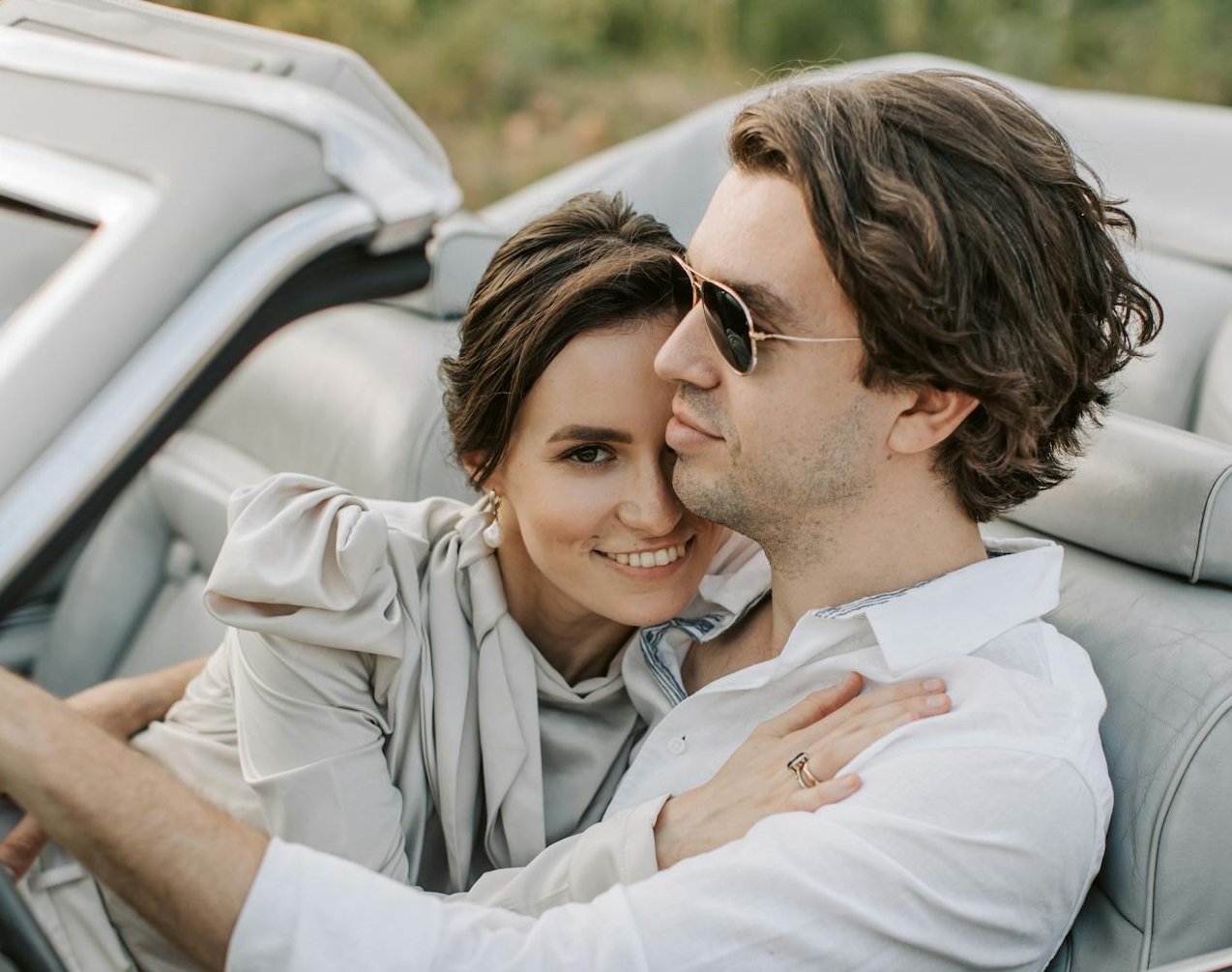 A Romantic Couple Sitting on the Car