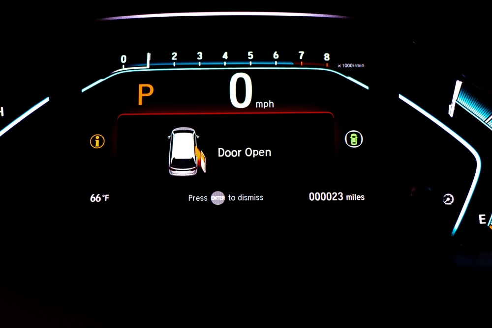Right sliding rear door open warning on instrument panel or dashboard control of modern minivan car