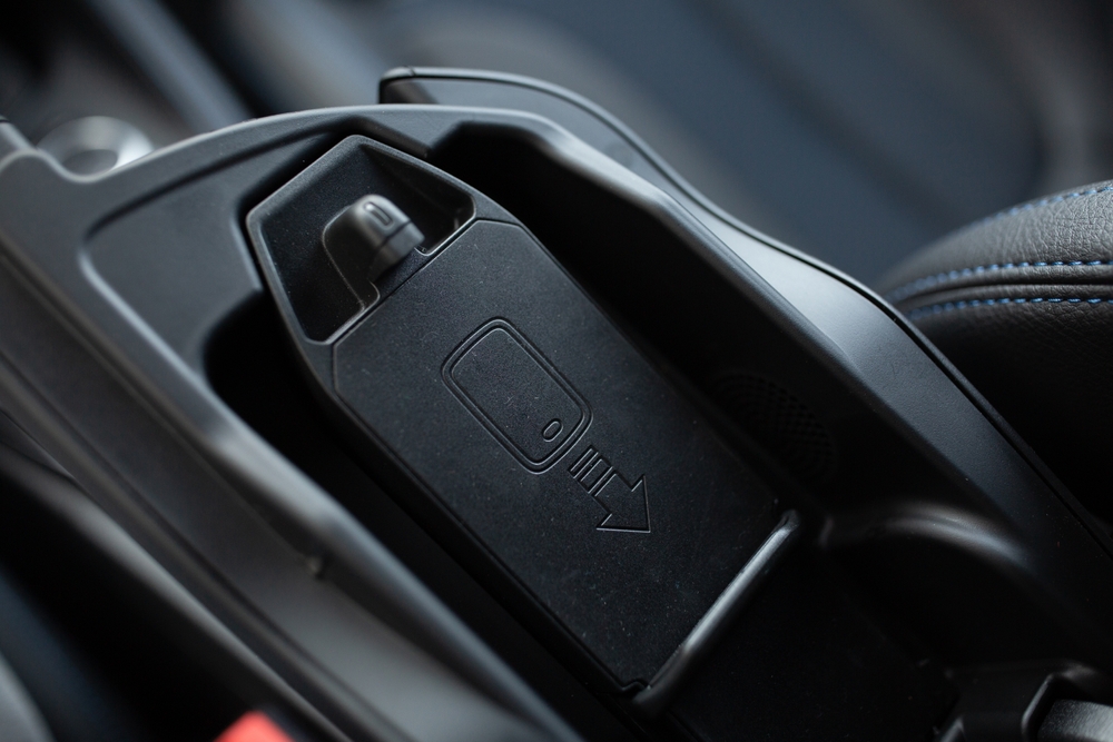 Phone wireless charger and holder inside a car