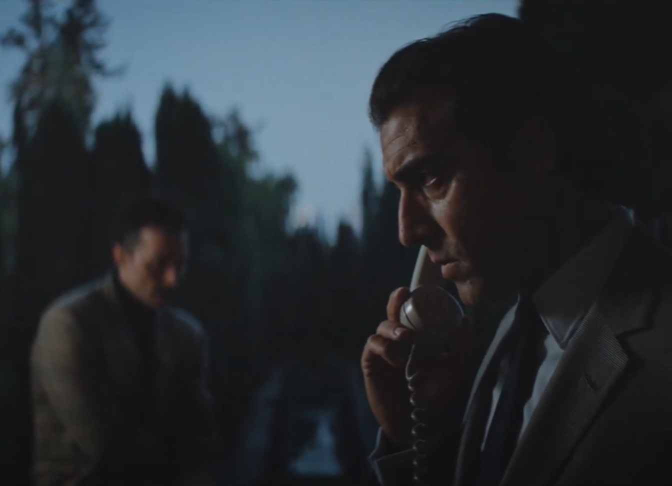 Screenshot of Giovanni Cirfiera (Agnelli) talking on the phone - from Ford v Ferrari (2019)