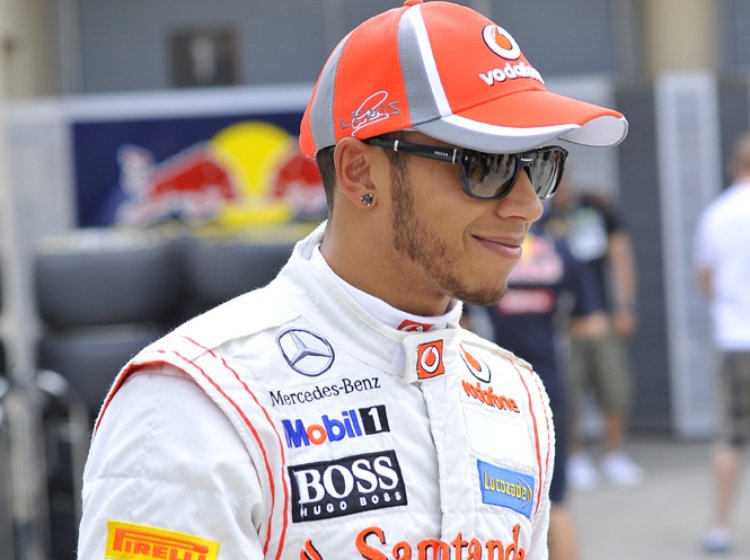 Lewis Hamilton wearing red cap
