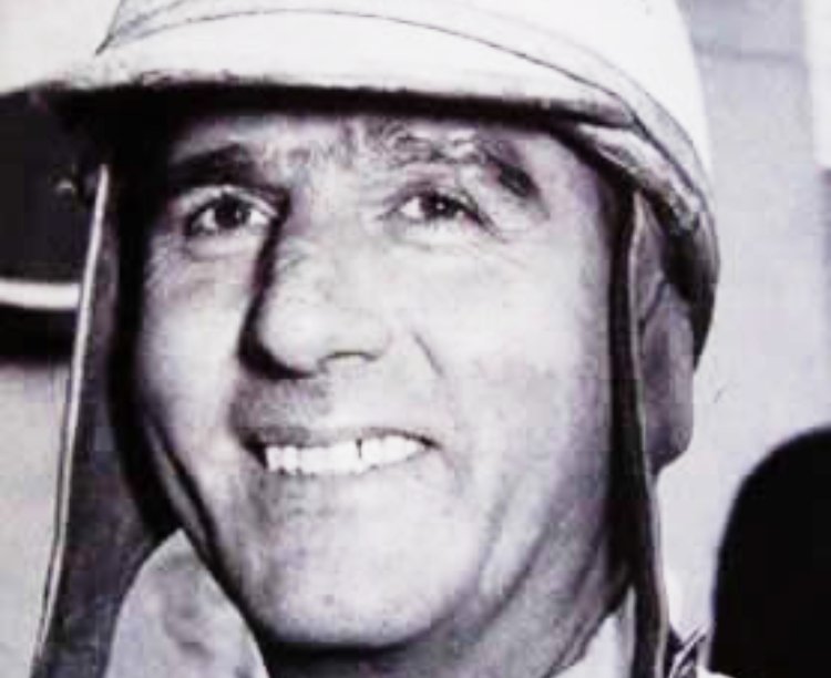 Giuseppe (Nino) Farina wearing white helmet