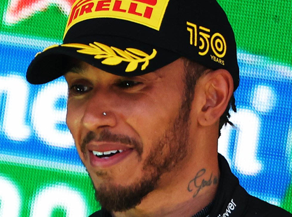 Lewis Hamilton wearing black cap