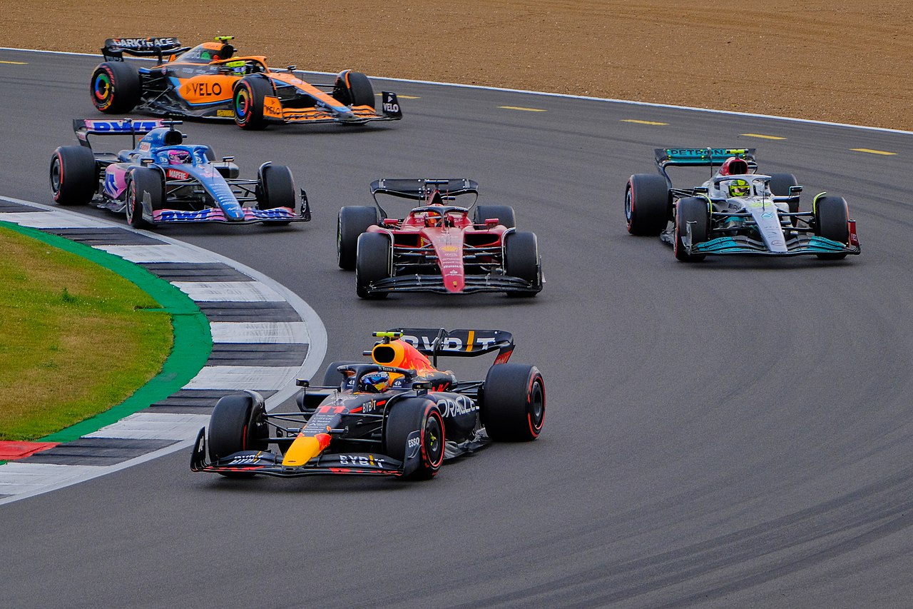 Formula 1 racing cars battling over the final podium place
