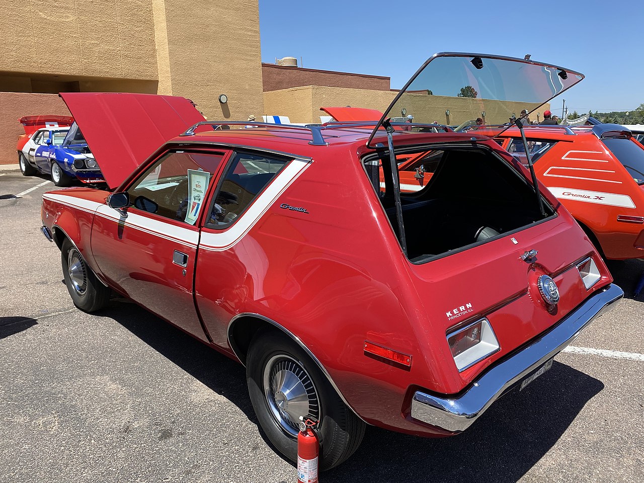 Rear left side view 1970 AMC Gremlin all original finished in red with white stripe 232 auto AC