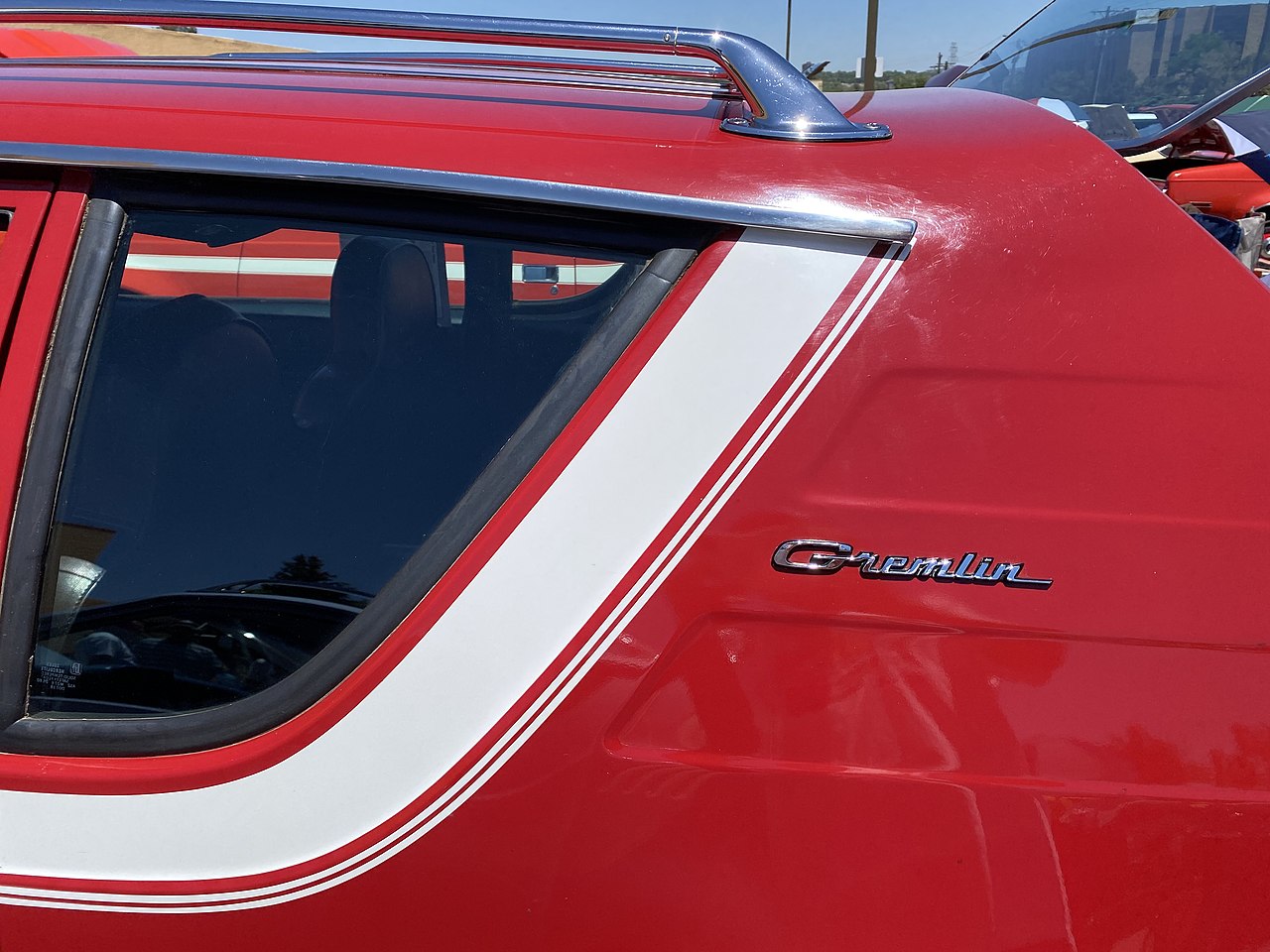 Detail of C pillar design on a 1970 AMC Gremlin all original finished in red with white stripe