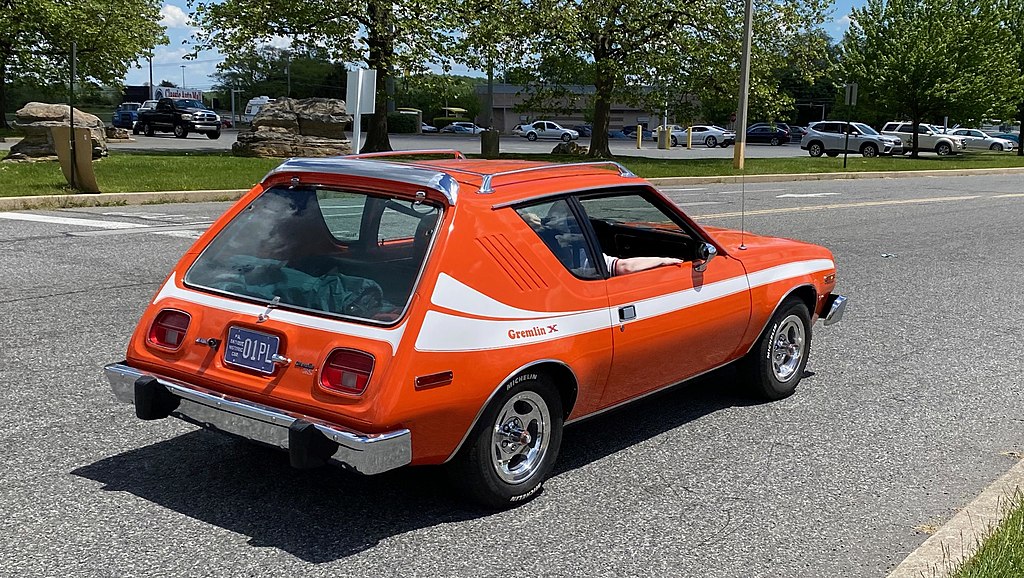 Rear right side view of a 1977 AMC Gremlin with X package on the road