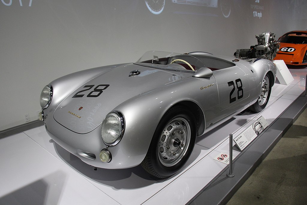 A close-up photo of a 1955 Porsche 550-1500 RS Spyder car on display at an exhibition