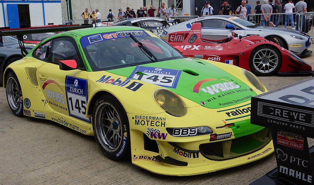 A close-up photo of a 2012 Porsche 997 GT3 car on display at an exhibition