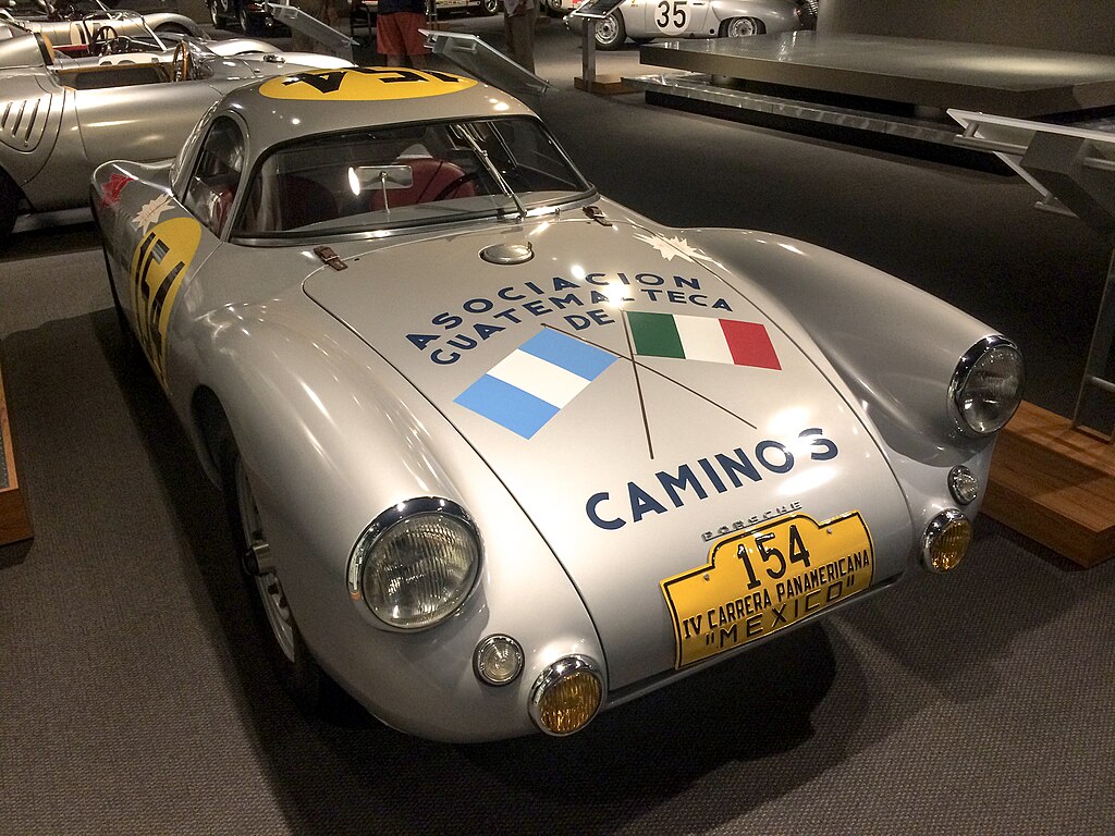A close-up photo of a 1953 Porsche 550 car on display at an exhibition
