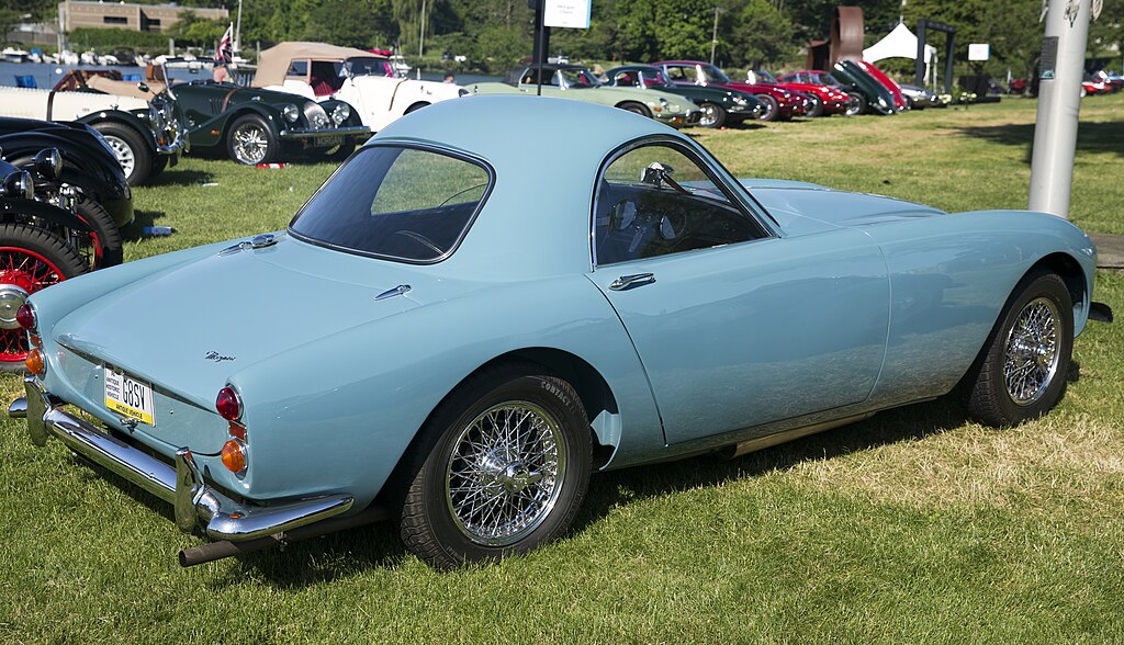 A close-up photo of a Blue 1964 Morgan Plus 4 car on display at an exhibition