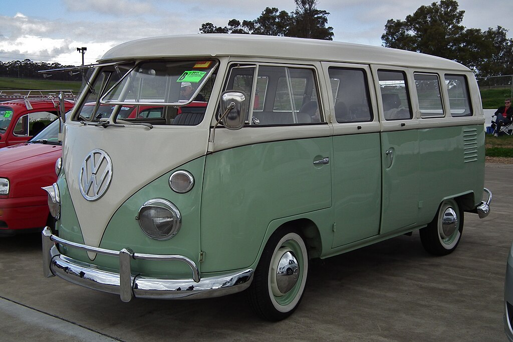 A close-up photo of a 1964 Volkswagen Camper car on display at an exhibition
