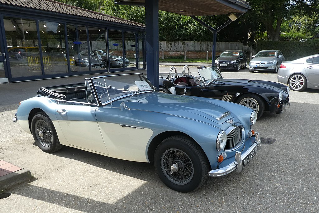 A close-up photo of a 1967 Austin-Healey 3000 Mark III car parked in a parking lot