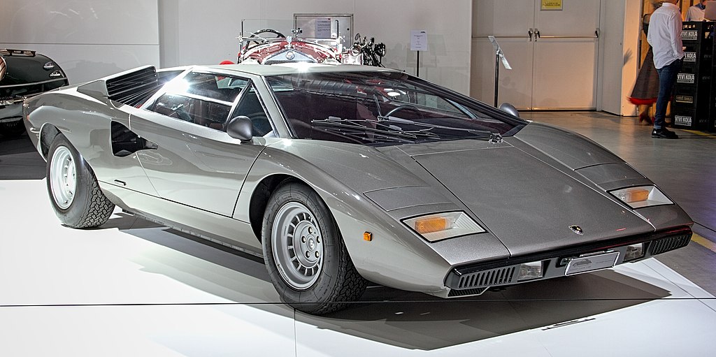 A close-up photo of a 1976 Lamborghini Countach car on display at an exhibition