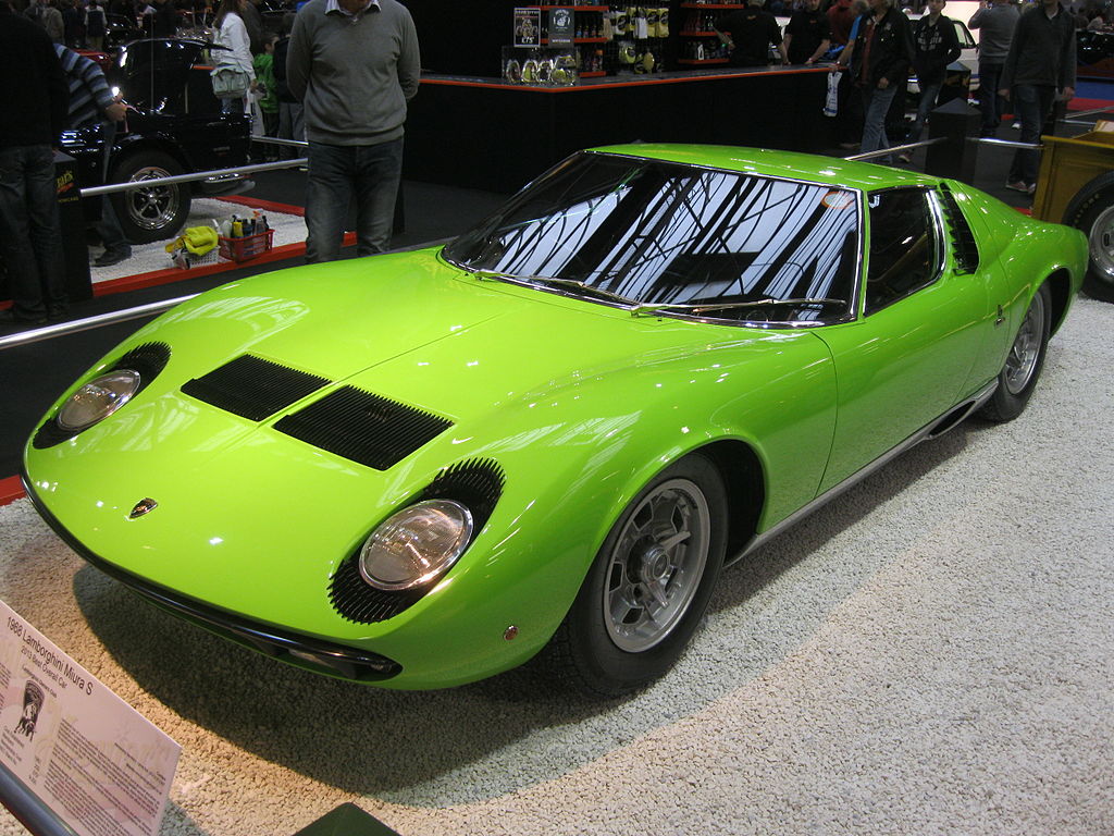 A close-up photo of a Green Lamborghini Miura P400S car on display at an exhibition