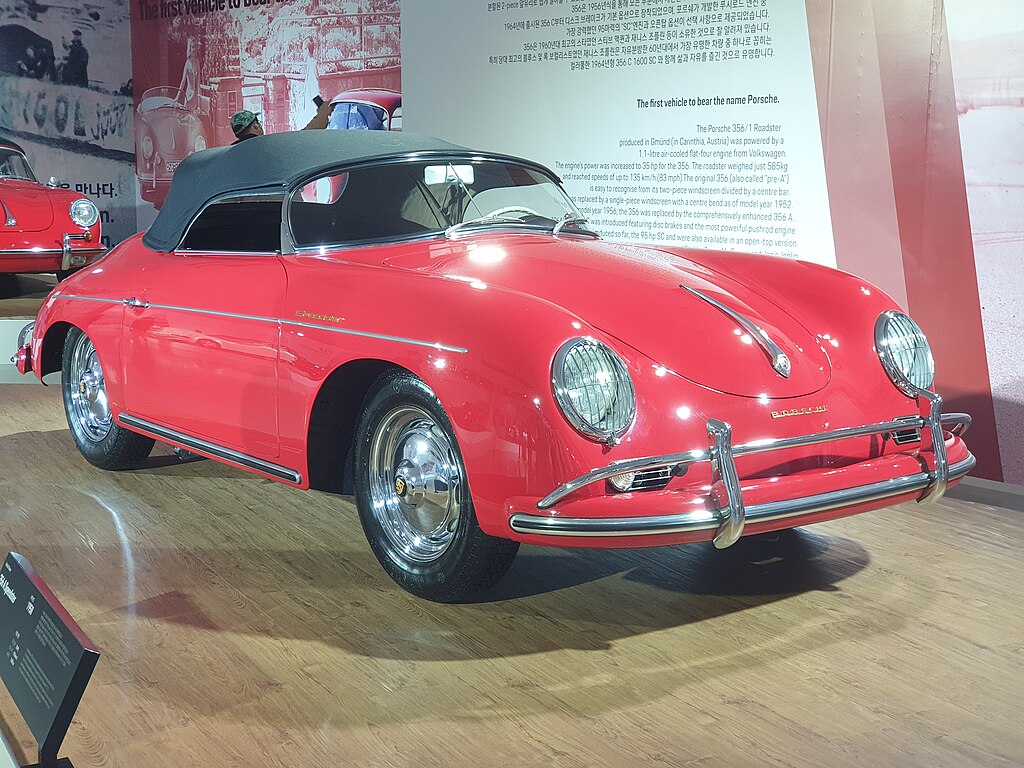 A close-up photo of a 1958 Porsche 356A Speedster car on display at an exhibition