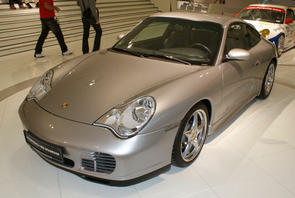 A close-up photo of a Porsche 996 Carrera car on display at an exhibition
