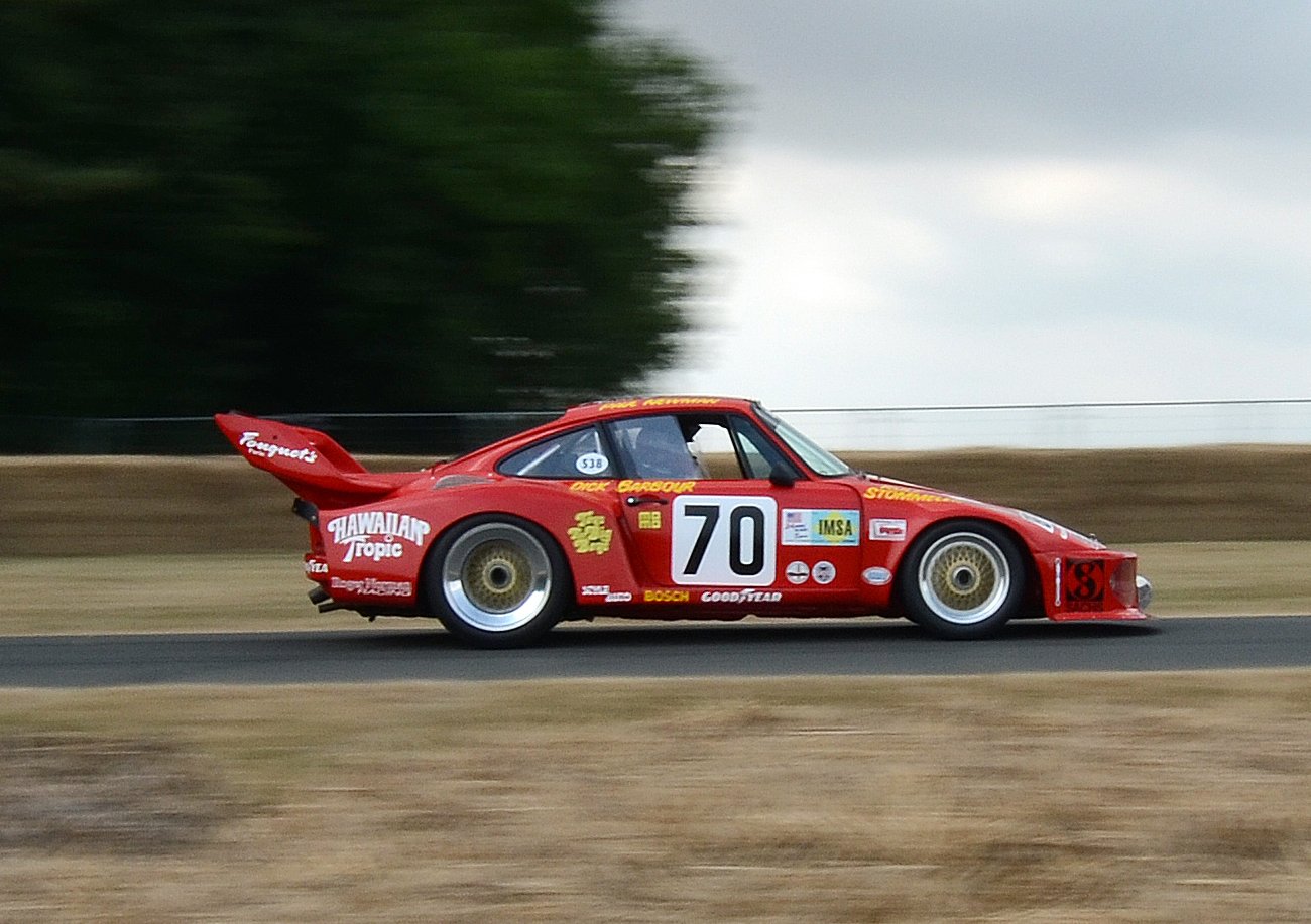 A close-up photo of a 1975 Porsche 935 in motion