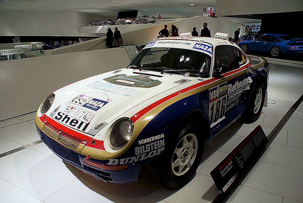 A close-up photo of a 1986 Porsche 959 car on display at an exhibition