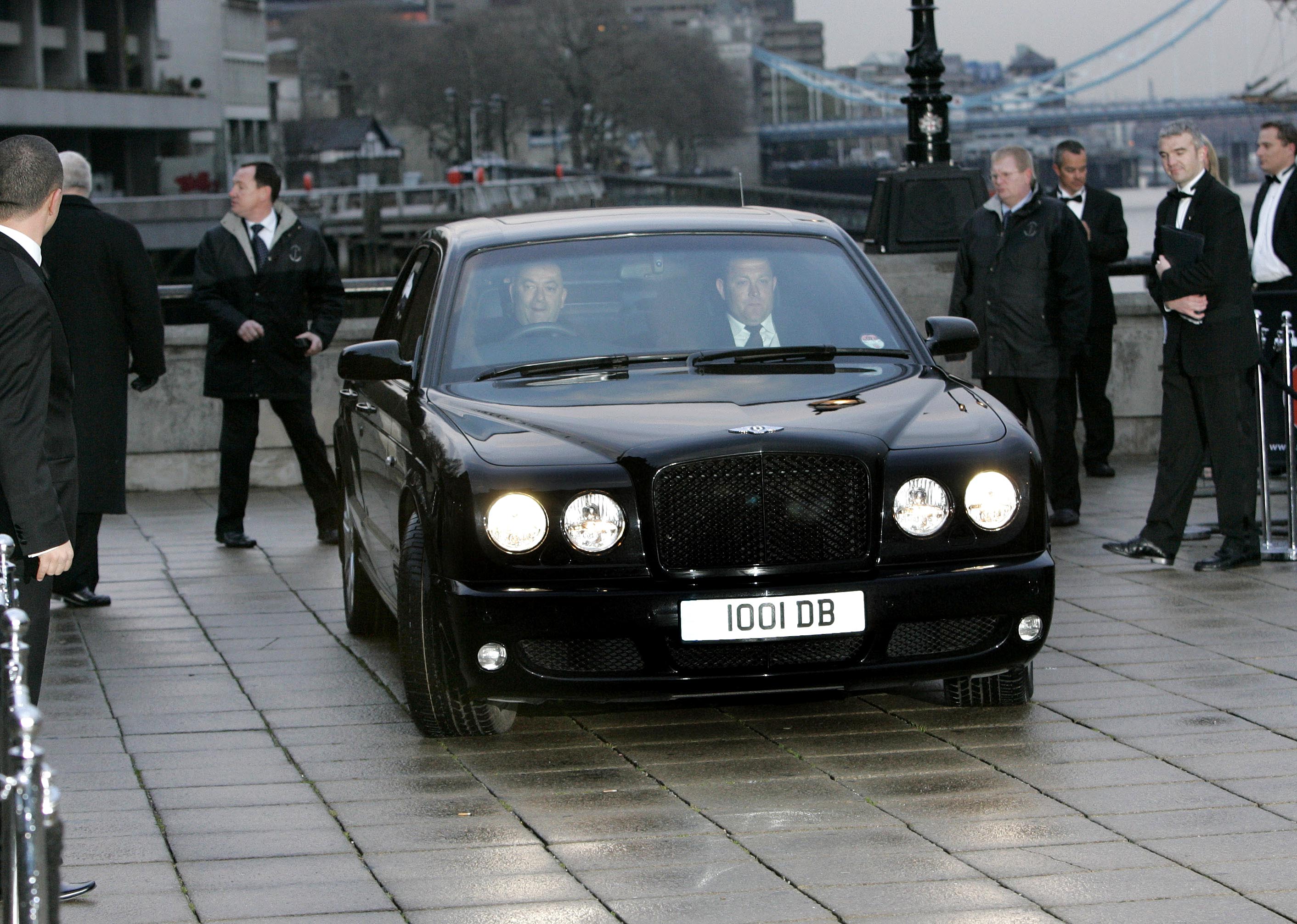 David & Victoria Beckham  in a car