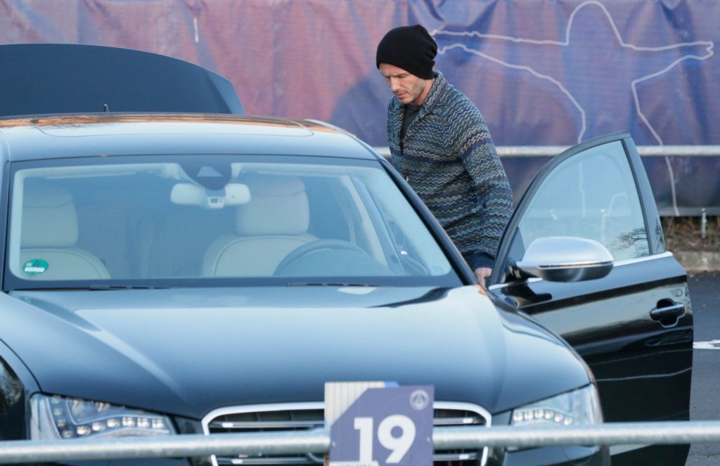 David Beckham getting in a car