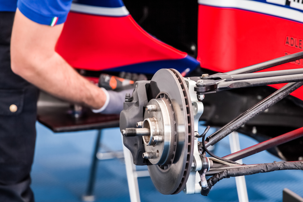Engineer working on F1 brakes.