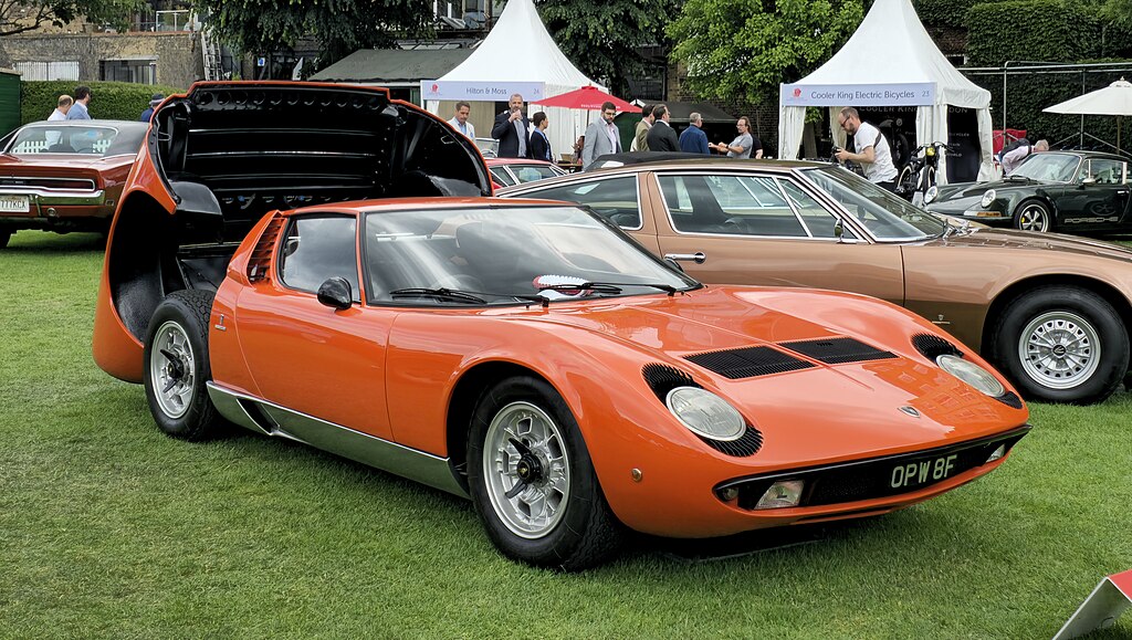 A close-up photo of a 1967 Lamborghini Miura P400 car on display at an exhibition