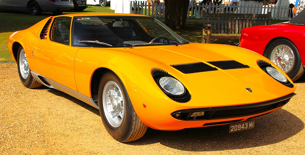 A close-up photo of a 1967 Lamborghini Miura P400 car on display at an exhibition
