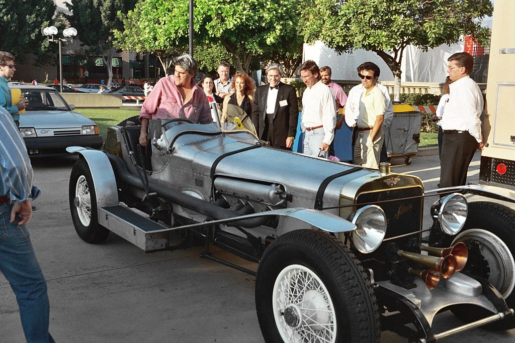 Portrait Photo of Jay Leno and one of his antique cars, a Hispano-Suiza 8