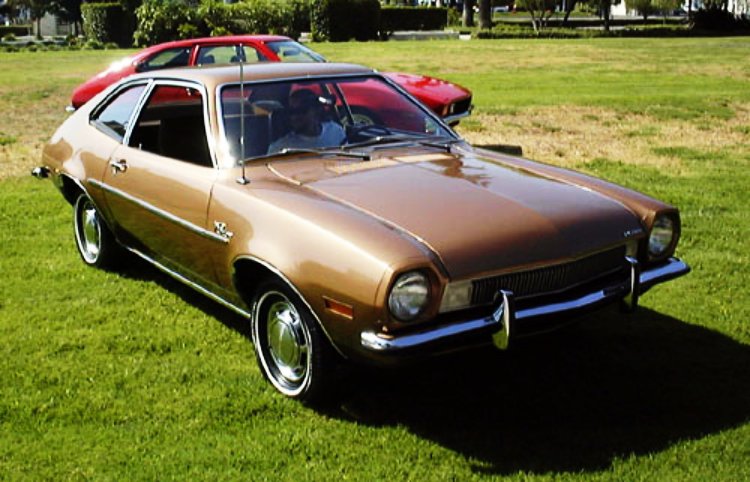 Gold Ford Pinto - Foreground car is a restored example