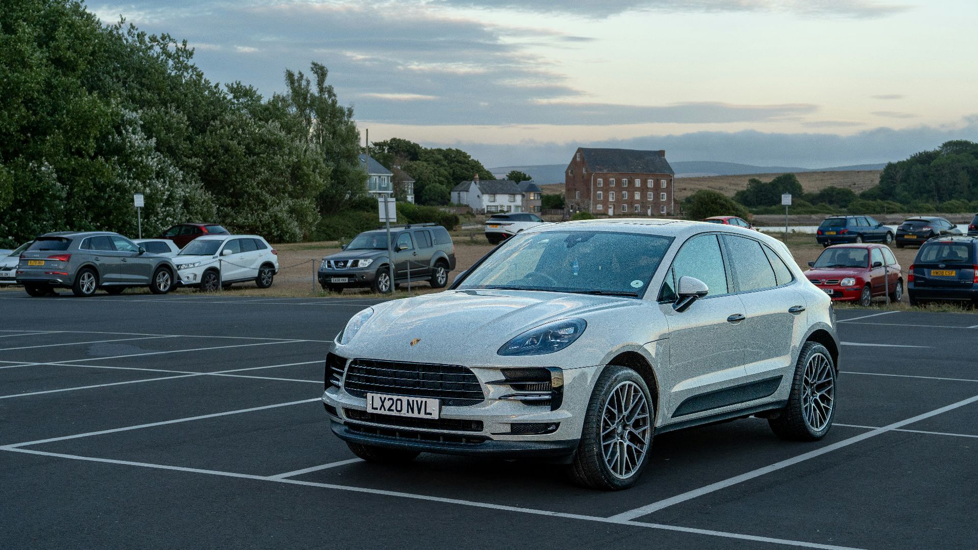 a white car parked in a parking lot