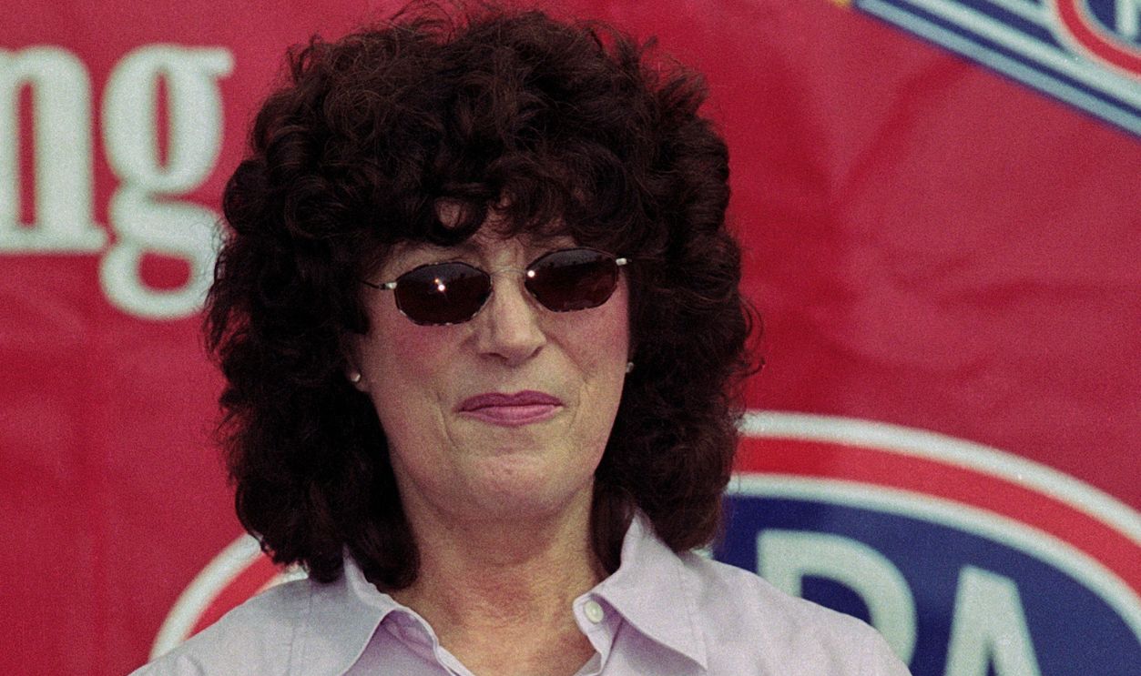 National Hot Rod Association (NHRA) Champion Driver Shirley Muldowney acknowledges crowd at the Pomona Raceway after being named the #5 Top 50 Driver from NHRAs first 50 years during ceremony, November 11, 2001 in Pomona, California. (