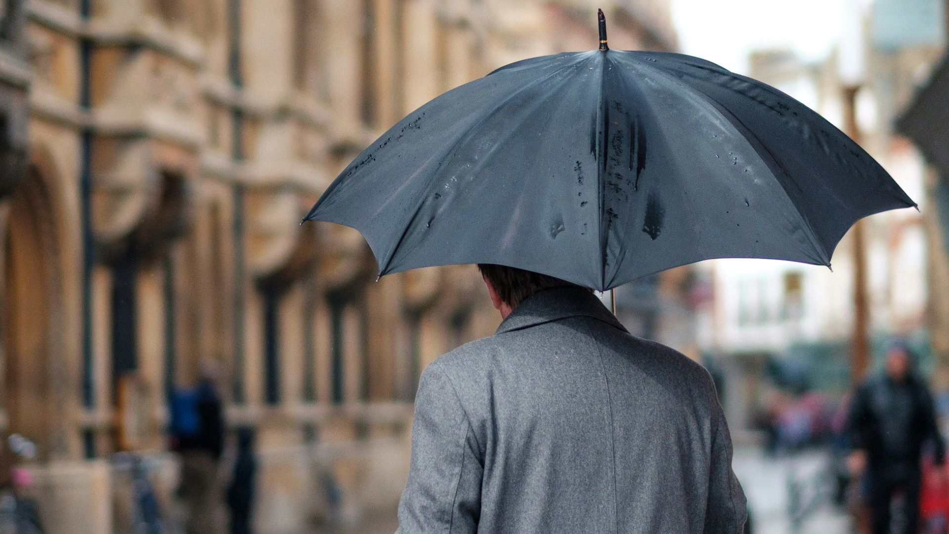 man holding umbrella