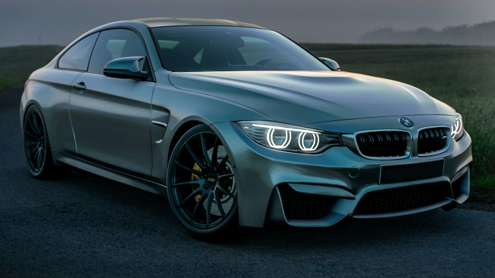 gray mercedes benz coupe on black asphalt road during daytime