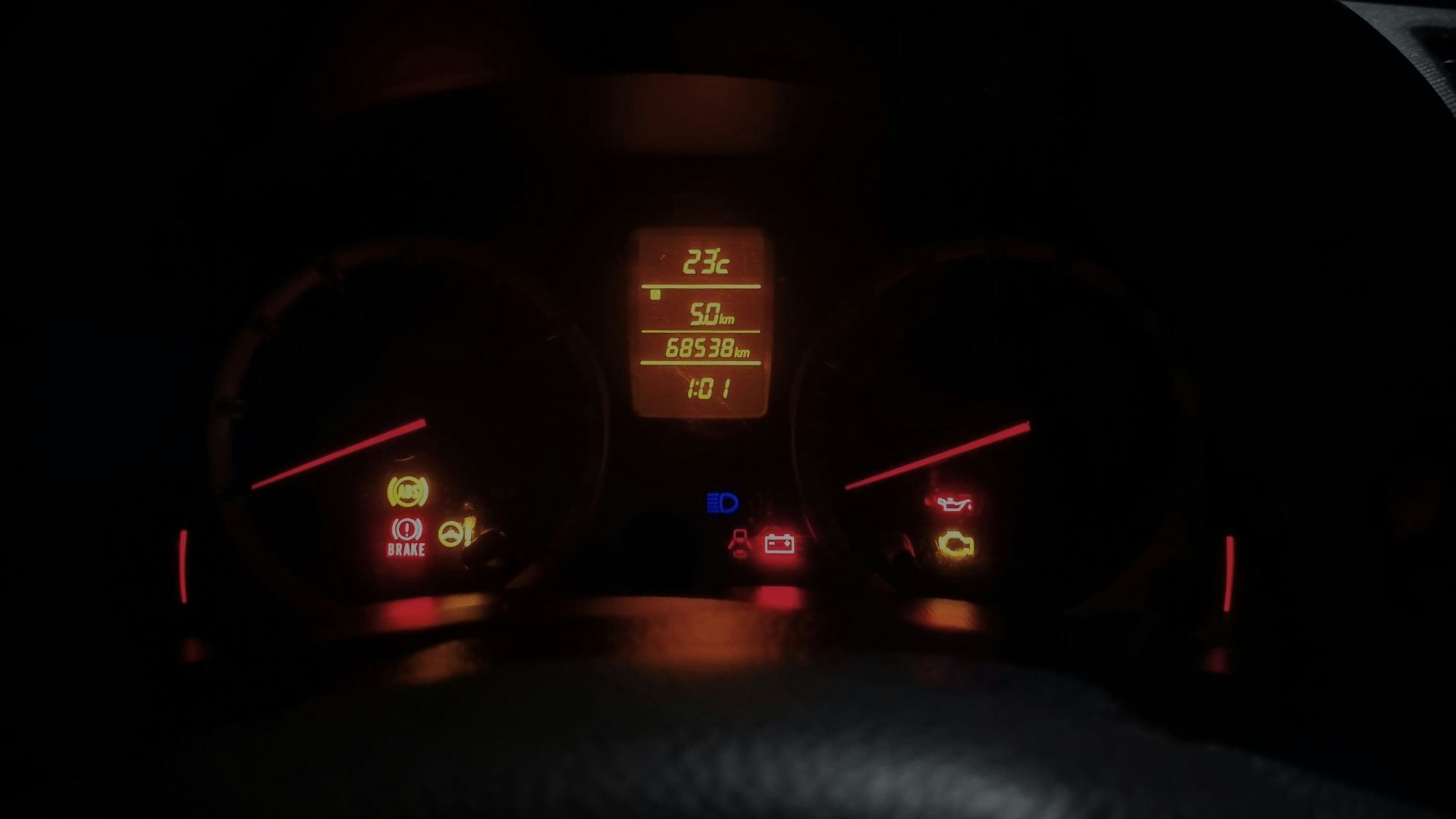 The dashboard of a car at night time
