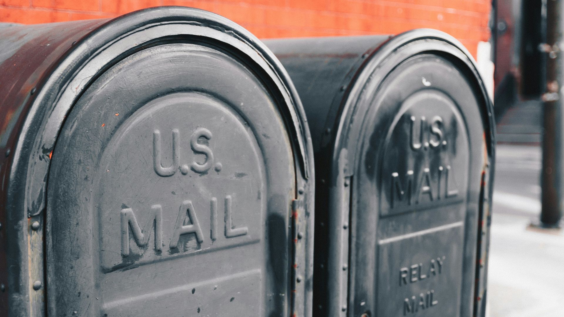 close view of two gray U.S mailboxes