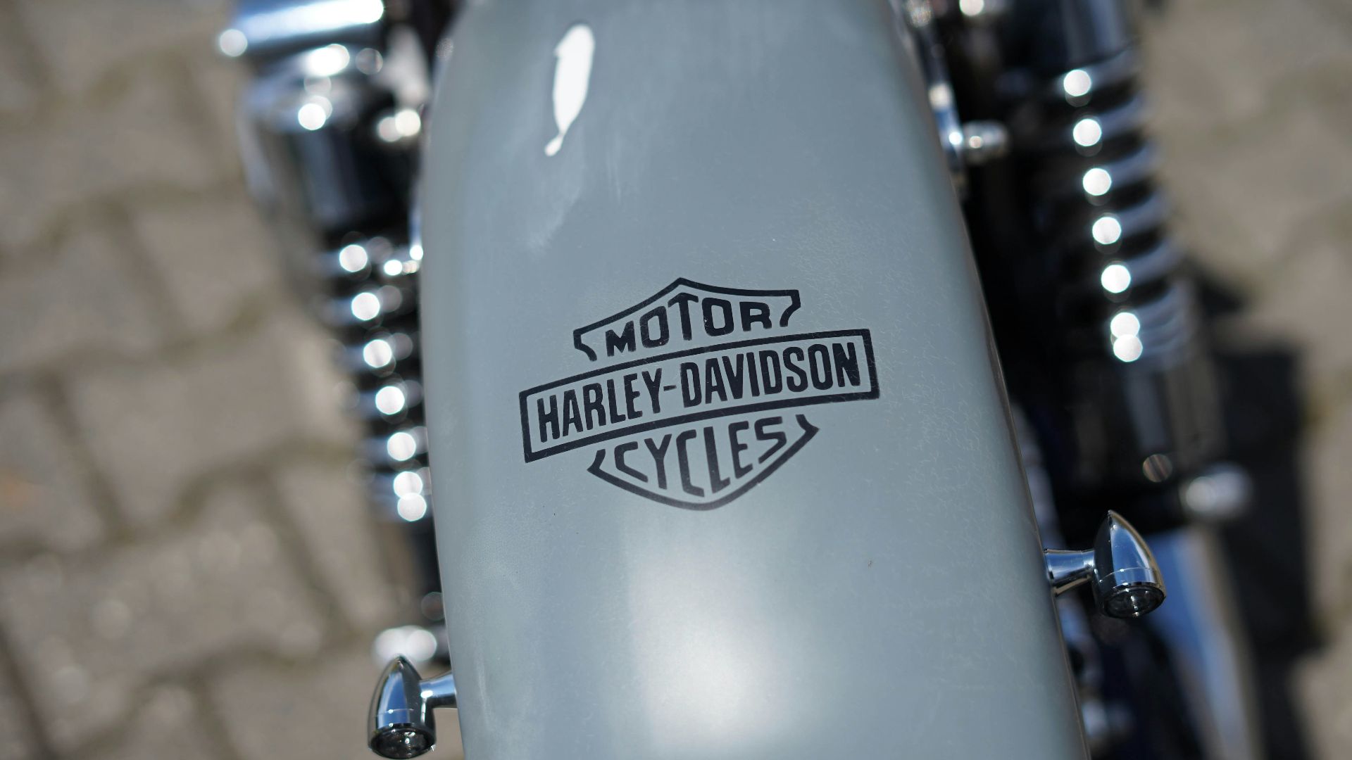 a close up of a motorcycle with a logo on it