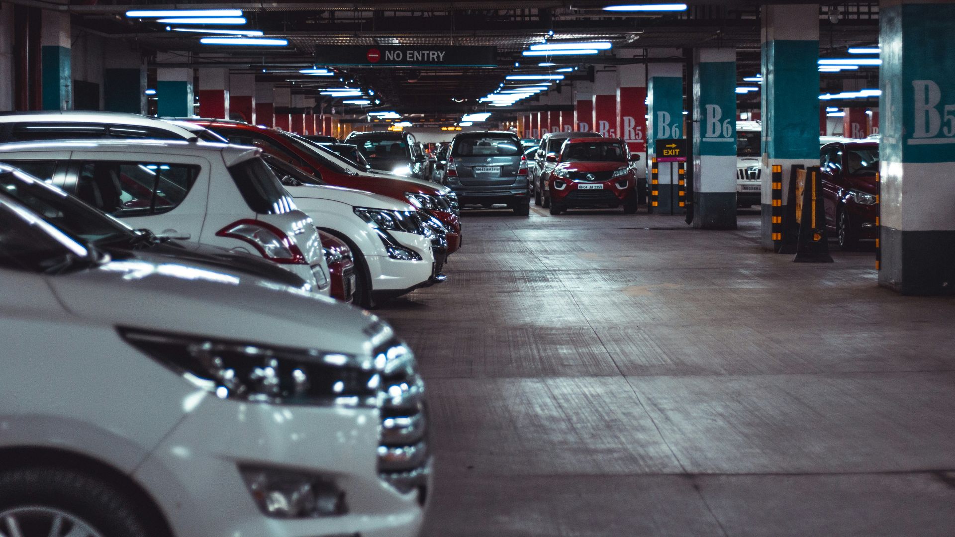 different vehicles parking on garage area of the building