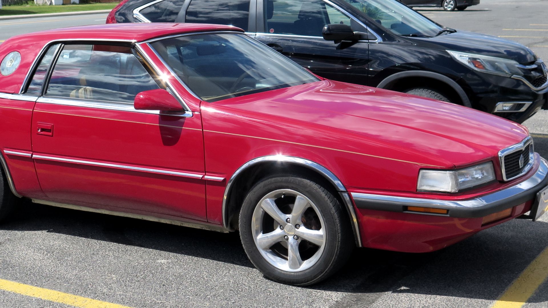 File:1991 Chrysler TC by Maserati in Exotic Red, Front Right, 08-13-2022.jpg