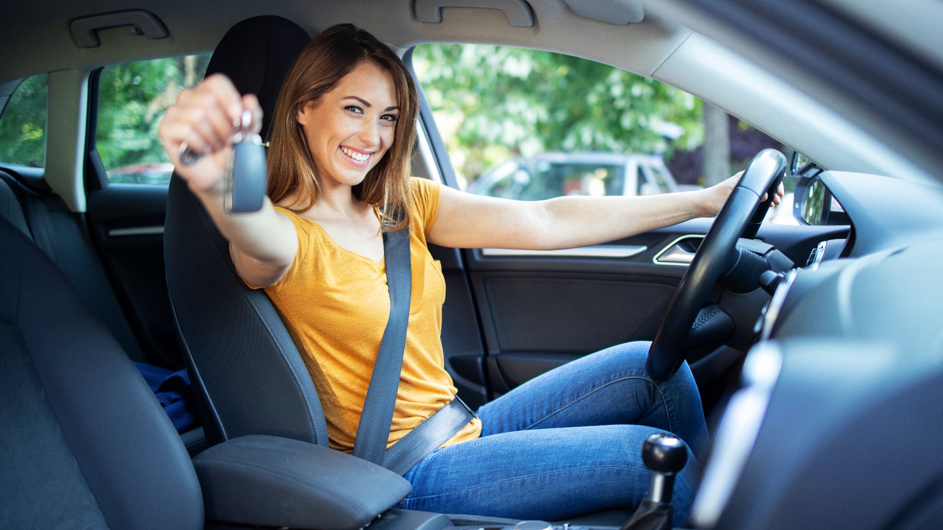 File:Beautiful-female-women-driver-sitting-her-vehicle-holding-car-keys-ready-drive.jpg
