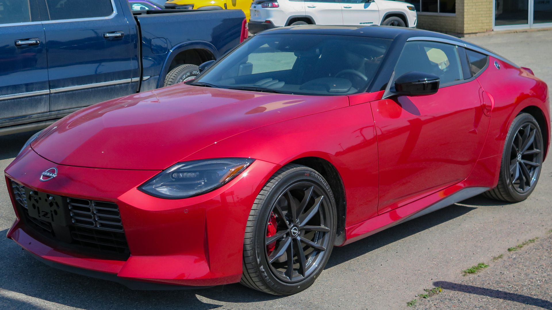 File:2023 Nissan Z Performance 6MT in Passion Red TriCoat, Front Left, 05-17-2023.jpg