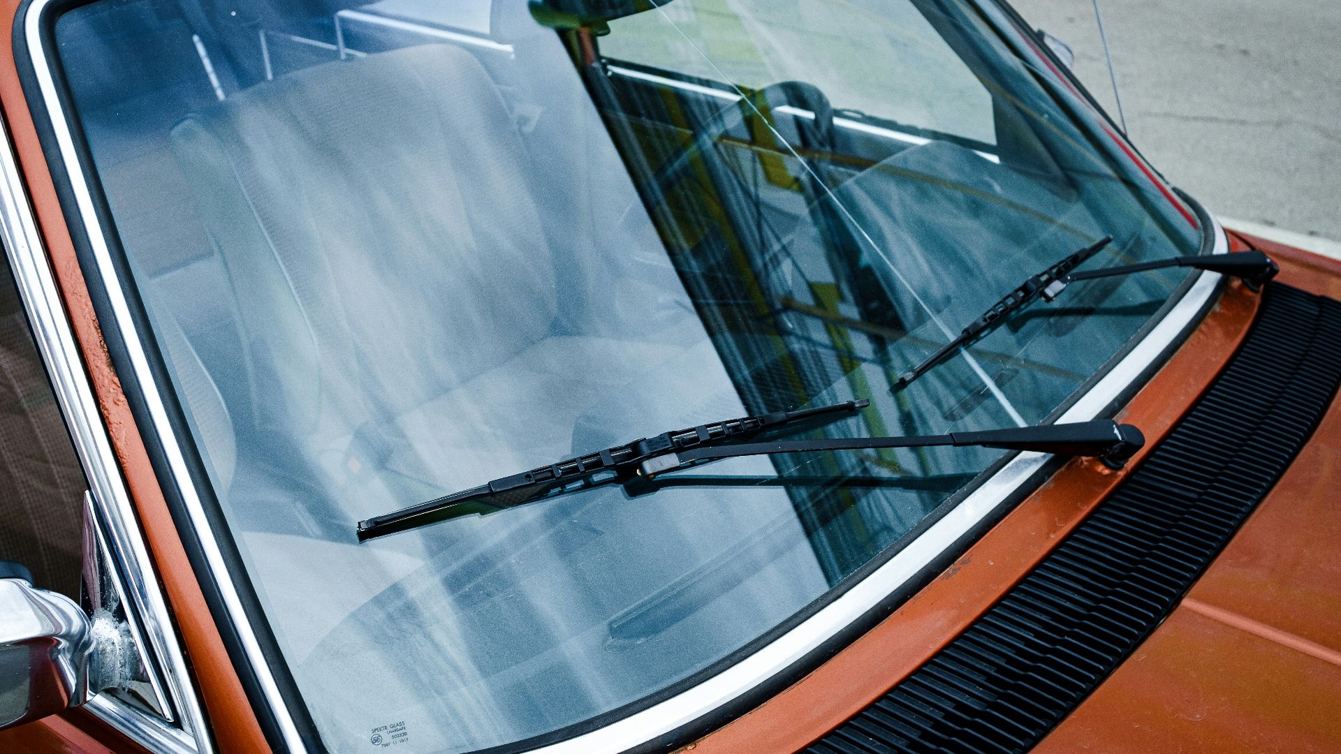 black car door with white window blinds