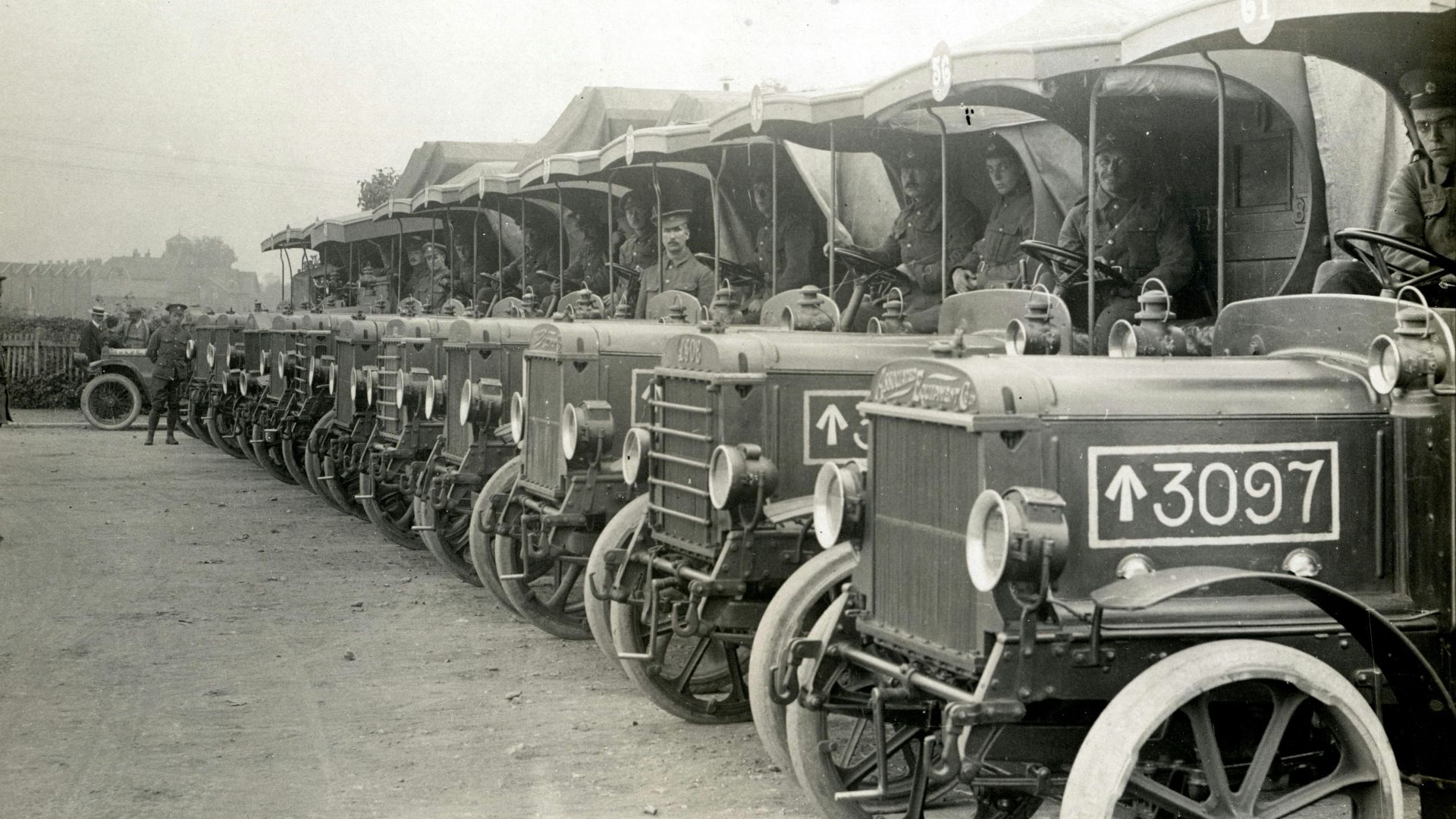 line of parked classic cars during day