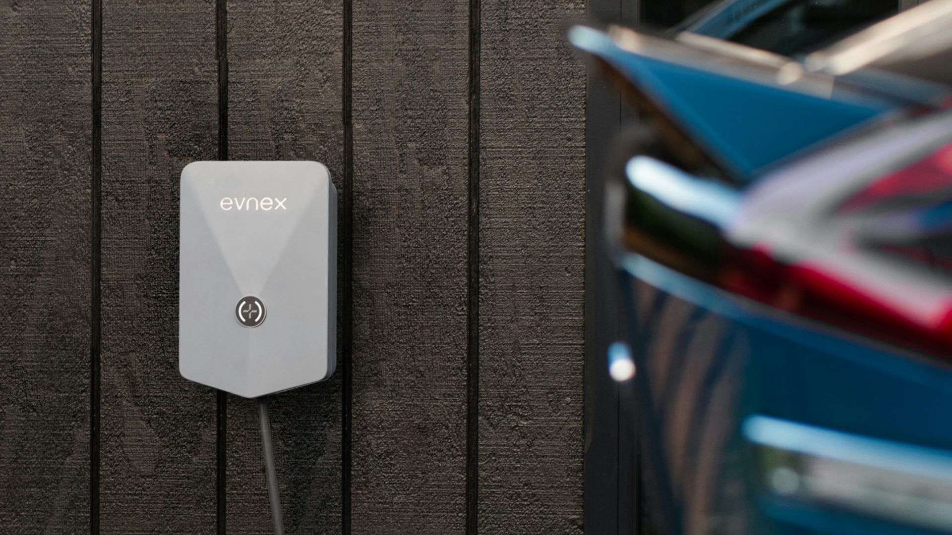 a car plugged in to a wall charger