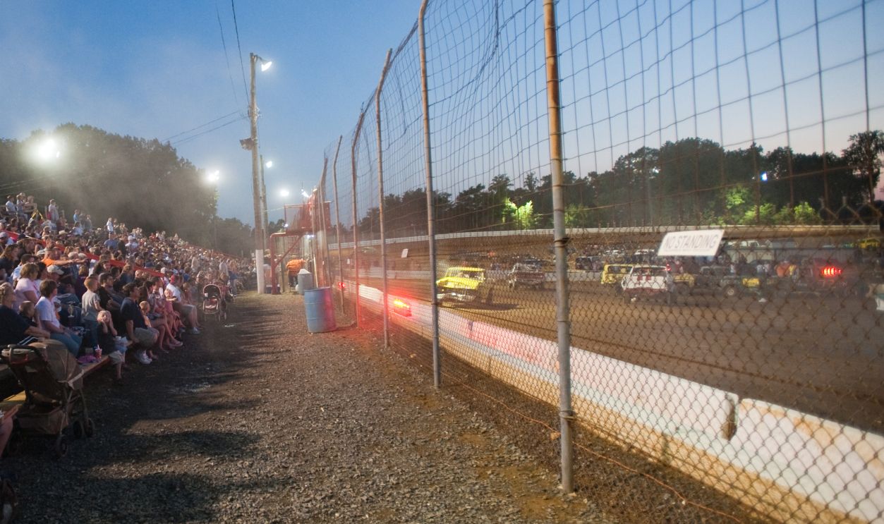 Spectators in the stands at a Demolition Derby.