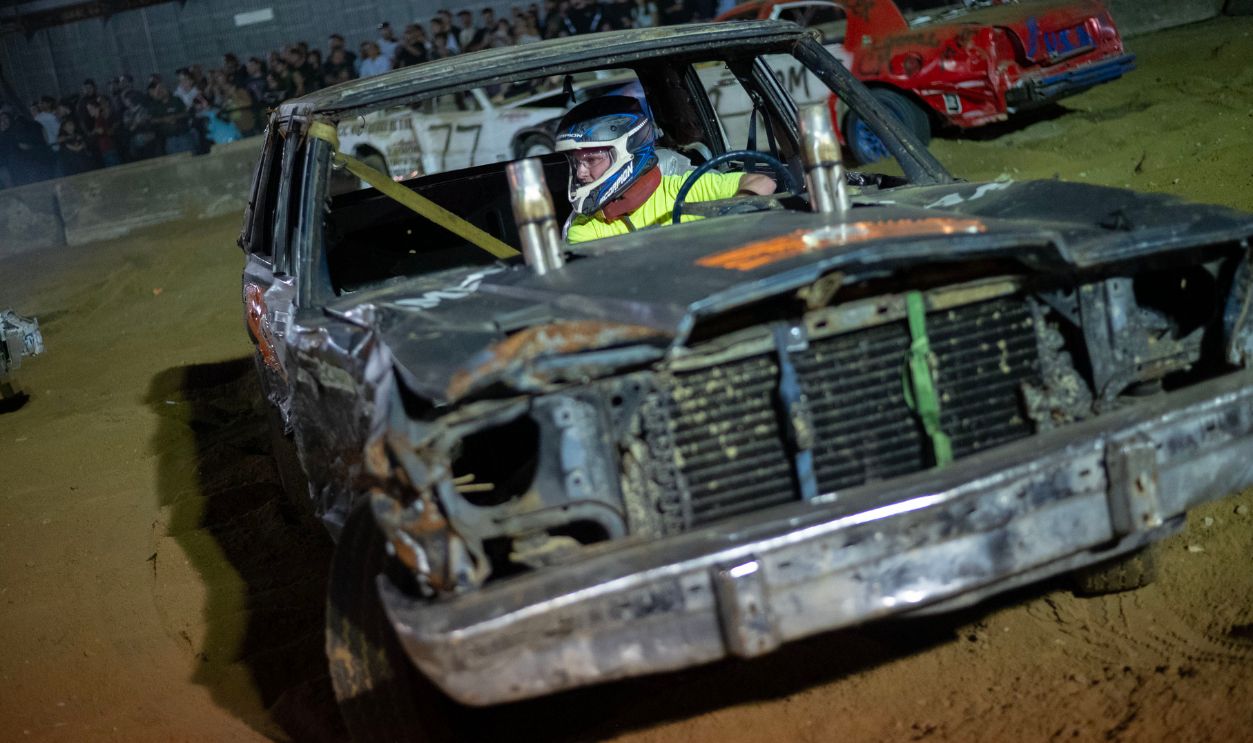 A driver maneuvers around the pit during the demolition derby at the Marshfield Fair on August 15, 2025.