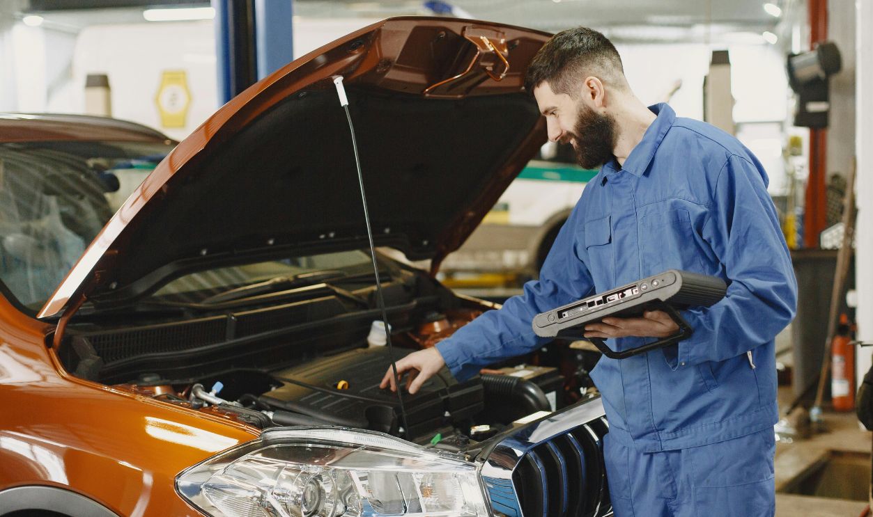 Mechanic checking engine