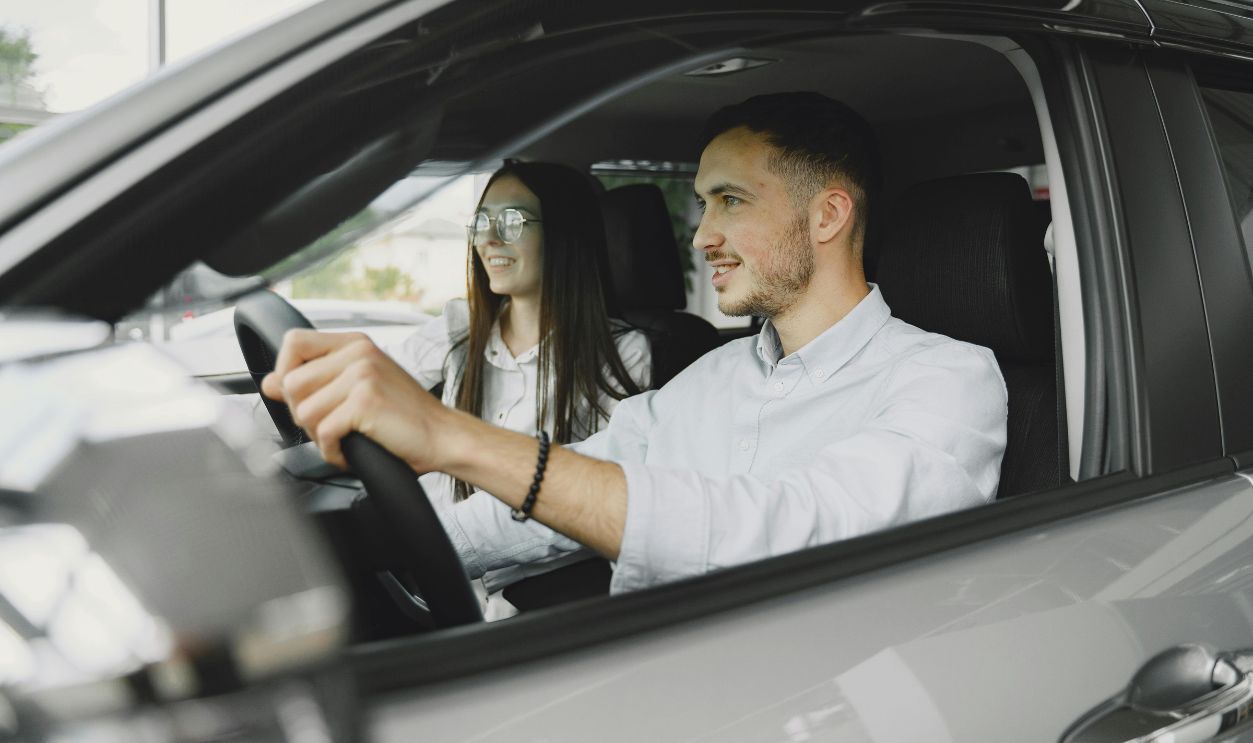 Couple sitting inside car